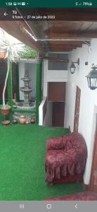 a room with a bed on the green grass at Taita wasi in Cajamarca