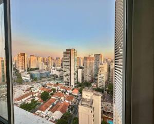 a view of a city skyline from a window at Mercure São Paulo vila Olimpia premium in Sao Paulo