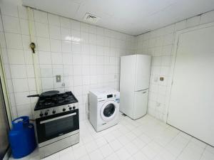 Kuchyň nebo kuchyňský kout v ubytování SG Homes