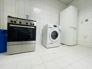 Kuchyň nebo kuchyňský kout v ubytování SG Homes