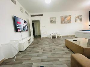 TV a/nebo společenská místnost v ubytování SG Homes