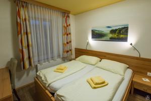 Postel nebo postele na pokoji v ubytování Egidiwirt Murau