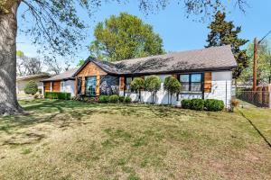 a house with a large yard in front of it at 10min to EXPO - Family-Friendly with Office & Playroom in Tulsa