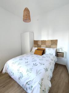 Ένα ή περισσότερα κρεβάτια σε δωμάτιο στο Apartamentos Torre de la Esquina