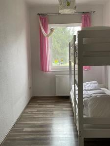 Katil atau katil-katil dalam bilik di Wunderschöne Wohnung in DoKi