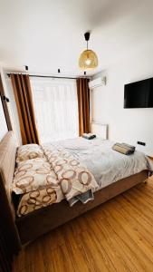 Een bed of bedden in een kamer bij Luxury apartament Buiucani