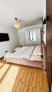 Een bed of bedden in een kamer bij Luxury apartament Buiucani
