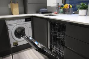 a dishwasher with its door open in a kitchen at Brand new Greenwich house-Heart of London-Great connections to Central London in London