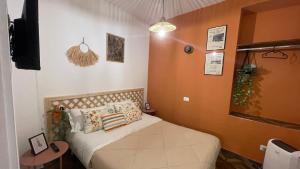 A bed or beds in a room at Santa Lucia Affittacamere
