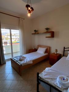 Ένα ή περισσότερα κρεβάτια σε δωμάτιο στο Garden Beach House