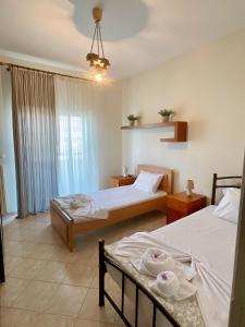 Ένα ή περισσότερα κρεβάτια σε δωμάτιο στο Garden Beach House