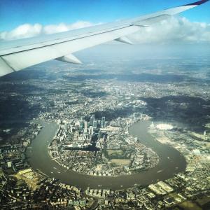 an aerial view of a city from an airplane at Wades Place E14 in London