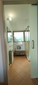 a bathroom with a sink and a glass shower at Apartamento Loft Mar&Pol in Palafrugell