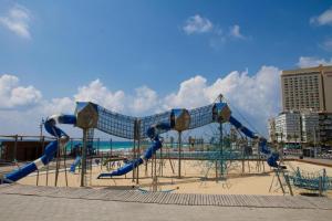 a playground on the beach next to the beach at Leonardo hotel , Very luxury suite, high floor, in fron of See in Bat Yam