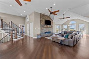 a living room with a couch and a fireplace at 7015 - Nirvana by Resort Realty in Rodanthe