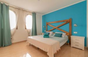 Un pat sau paturi într-o cameră la Casa Paraiso Papagayo