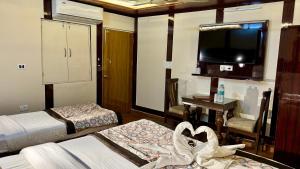 Postel nebo postele na pokoji v ubytování Golden Residency