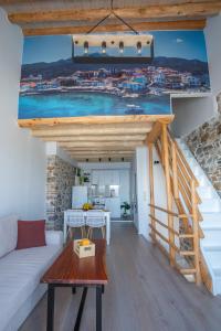 a living room with a view of the ocean at A window to the Aegean in Kokkari