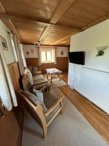 TV a/nebo společenská místnost v ubytování Ferienhaus Axmann