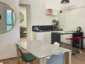 Kuchyň nebo kuchyňský kout v ubytování B&B Case Vacanza Orchidea marina di Macchia vicino a Mattinata Gargano