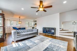 a living room with a couch and a ceiling fan at Charming Atlanta Home with Yard 7 Mi to Downtown! in Atlanta
