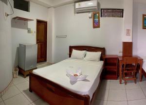 Una cama o camas en una habitación de Hostal Ventura Isabel