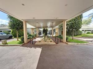a building with a courtyard with a tree in the middle at #T03 DUCAL MARINA BAIE DES ANGES avec Terrasse in Villeneuve-Loubet +2 photos