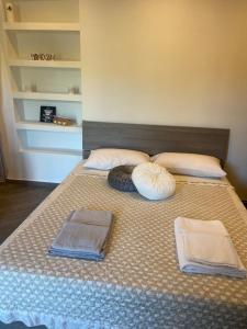 Ein Bett oder Betten in einem Zimmer der Unterkunft La Casetta Nel Borgo di Bagnaia