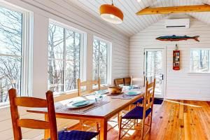 a dining room with a table and chairs at Cottage on the Coast in Rockport