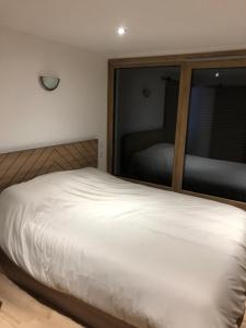 En eller flere senge i et værelse på Location comme à la maison