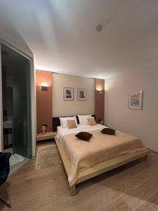 Postel nebo postele na pokoji v ubytování Zigante Rooms