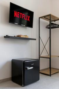 TV a/nebo společenská místnost v ubytování Shiny Rooms Verona