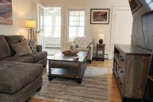 a living room with a couch and a coffee table at Majestic Lakeview Duplex Apt for 8! Fully furnished and ready for your getaway! in Tilton