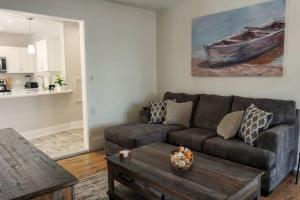 a living room with a couch and a table at Majestic Lakeview Duplex Apt for 8! Fully furnished and ready for your getaway! in Tilton