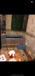 a table with wine glasses on top of it at Boutique Colonial House Hotel in Santo Domingo