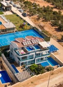 an aerial view of a building with a pool at Penthouse duplex "il GiraSole suite" in Kalkan