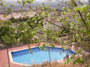 a swimming pool with a view of a city at comfortable single bluing room b&b in Granada