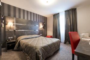 Postel nebo postele na pokoji v ubytování Hostellerie St Vincent