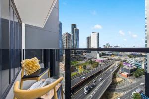 a balcony with a view of a city at A Modern & Spacious 2BR Apt City Views Southbank in Melbourne