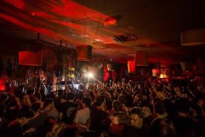 a crowd of people sitting in a room with a stage at A Lux & Cozy 2BR Apt in the Heart of Chapel Street in Melbourne