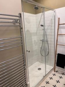 a shower with a glass door in a bathroom at La périgourdine et son spa in Saint-Cyprien +14 photos