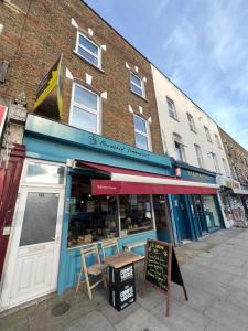 a store on a street in front of a building at Sweet Homes in London