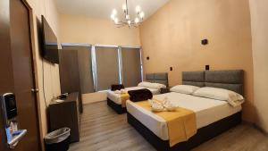 מיטה או מיטות בחדר ב-Casa Madero 227