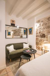 a living room with a couch and a table at Old Town City Center Apartments in Dubrovnik