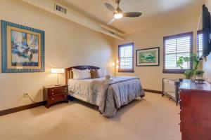 a bedroom with a bed and a dresser and windows at Stunning Coeur dAlene Condo Walk Downtown in Coeur d'Alene