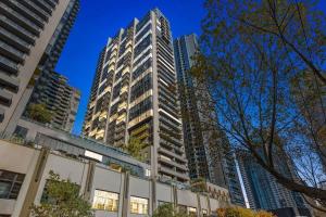 a group of tall buildings in a city at A Large 2BR Apt Near Crown Sleeps 8 FREE Parking in Melbourne