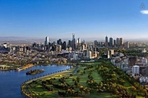 an aerial view of a city with a river at A Chic Apartment on Bourke St Near Chinatown in Melbourne