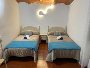 Postel nebo postele na pokoji v ubytování Casa Rural La Aldea + 37 fotografií