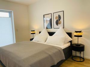 En eller flere senge i et værelse på LIGHTPLACE - Moderne Apartments in Braunschweig - Balkon - Netflix - Am Kanal