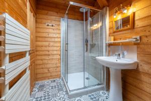 a bathroom with a shower and a sink at Chalet-Sixtine A large family chalet of 600m2 near La Clusaz in Saint-Jean-de-Sixt +60 photos
